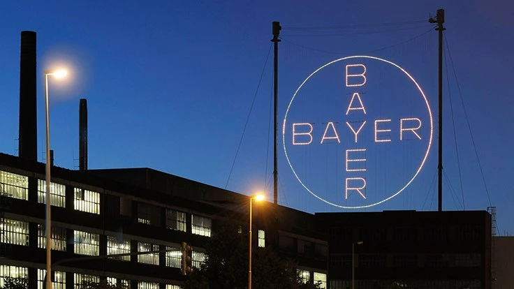 Light-up sign that reads "Bayer"