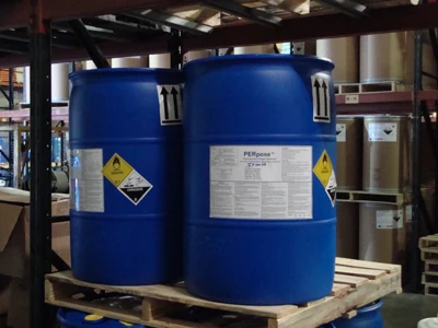 two blue storage drums on a pallet