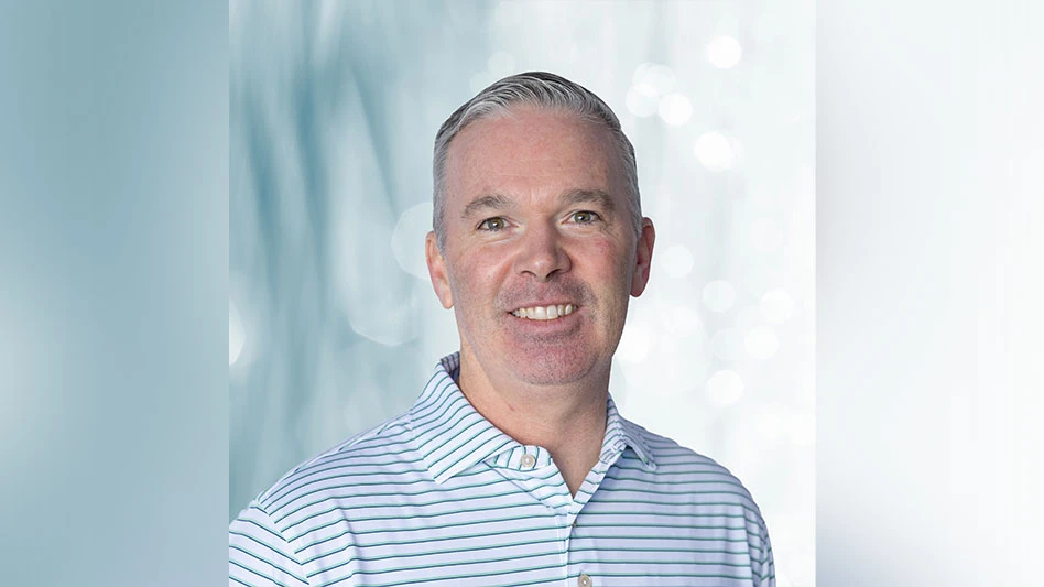 Headshot: A man wearing a blue and white striped shirt.
