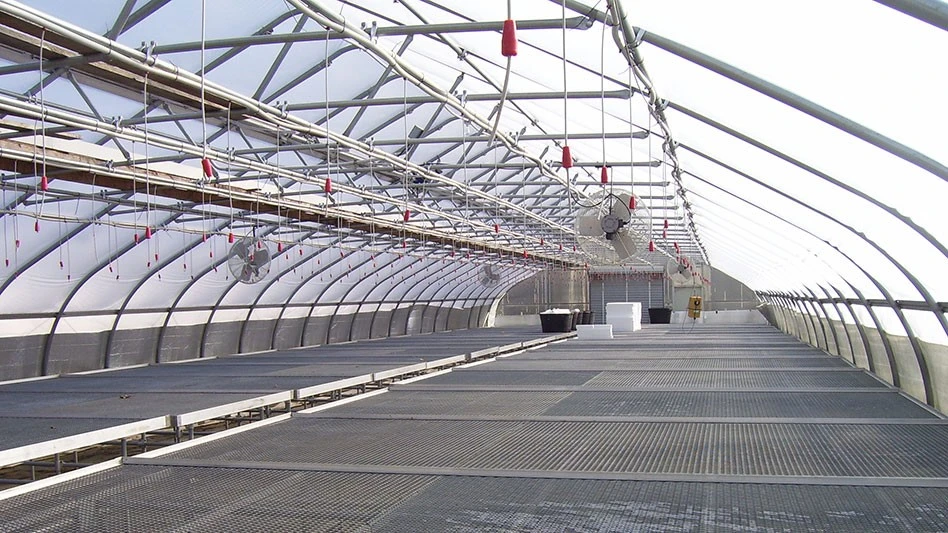 Double-bubble insulation between the frame and wall poly keeps the heat inside the greenhouse.